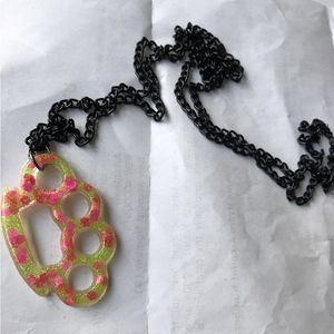 Handmaderesin Brass knuckle necklace. Yellow neon glitter with neon pink hearts 